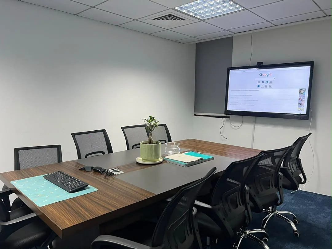 CNK Real Estate meeting room with a presentation screen